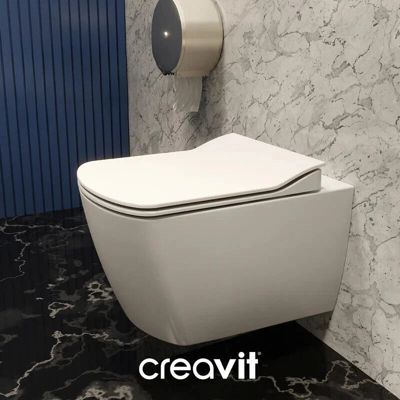 Creavit modernes wandhängendes dusch-wc mit weißem Sitz und geschlossenem Deckel in elegantem Badezimmer