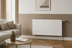 Weißer Ventilheizkörper von Pekpan an der Wand im modernen Wohnzimmer neben Sofa und Couchtisch
